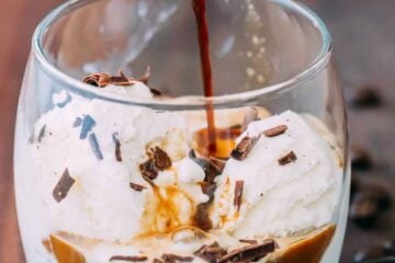 Pouring espresso over ice cream for affogato