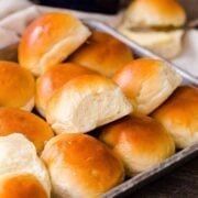 Dinner rolls on baking sheet served with butter