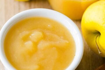 applesauce recipe in white bowl with fresh apples