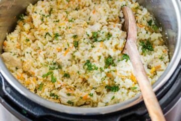 Instant Pot Chicken and Rice inside instant pot with spoon