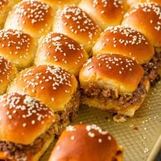 Cheeseburger sliders served on baking sheet
