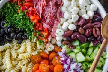 Italian pasta salad in serving bowl with Italian dressing