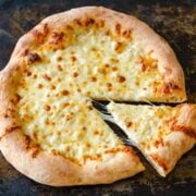 Homemade Pizza Dough Recipe baked with cheese topping