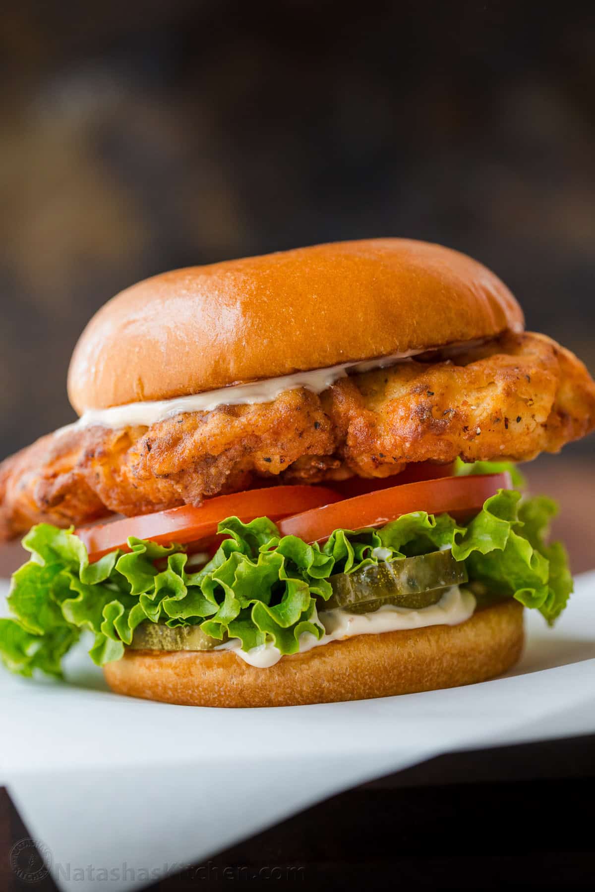 Crispy chicken sandwiches served in a bun with sandwich toppings