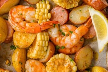 Shrimp Boil Recipe on Sheet Pan with lemon wedges