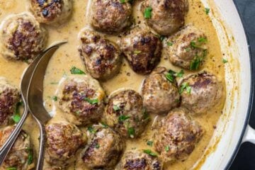 Swedish Meatballs in cream sauce with serving spoon