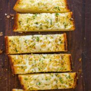 Sliced Garlic Bread on cutting board