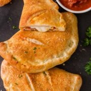 Baked Calzones served with marinara sauce