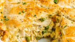 Chicken pot pie with a slice removed