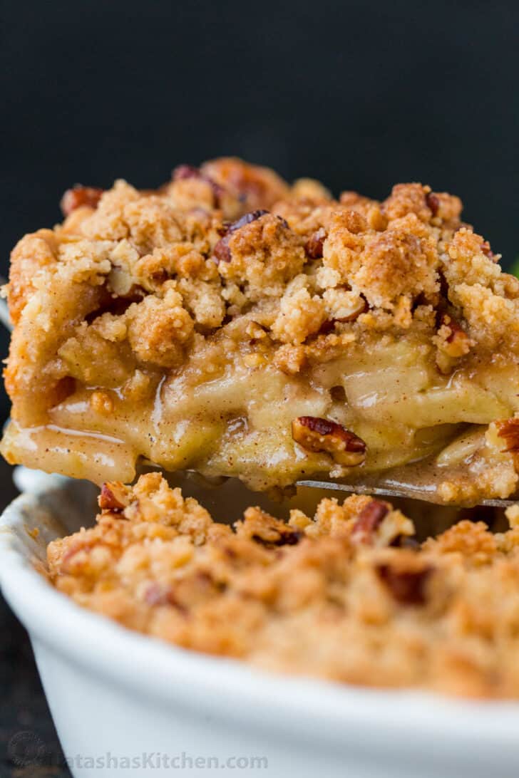 Dutch apple pie slice on a spatula