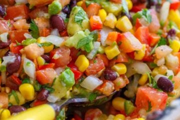 Cowboy caviar ingredients in a large bowl ready to serve with a spoon