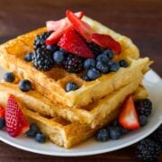 Stack of homemade waffles with berries