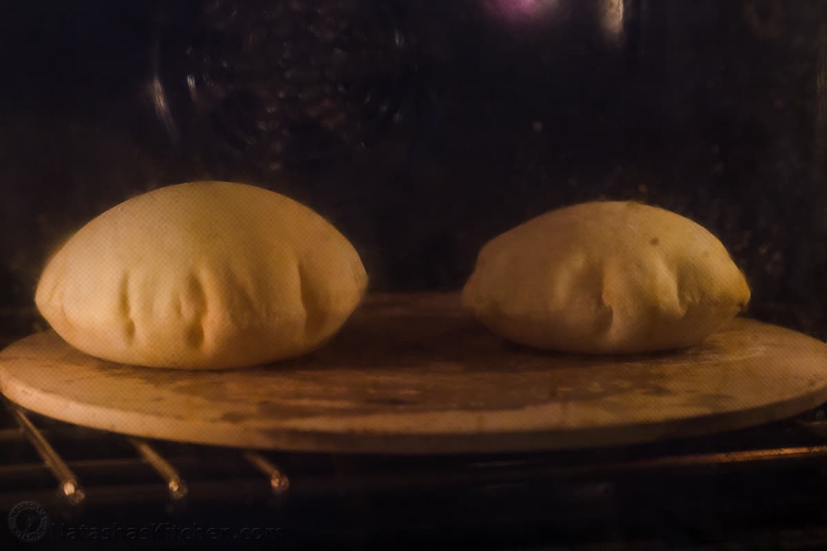 Pita bread puffing in the oven