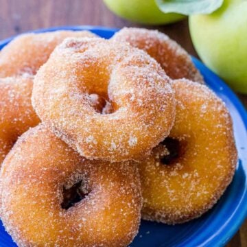 Apple fritters coated in cinnamon sugar served on plate