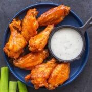 Buffalo chicken wings served with dip and celery