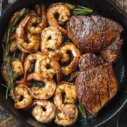 Surf and Turf on a skillet with garlic rosemary butter