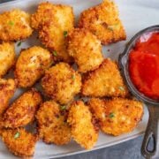 Popcorn Chicken served on a platter with ketchup