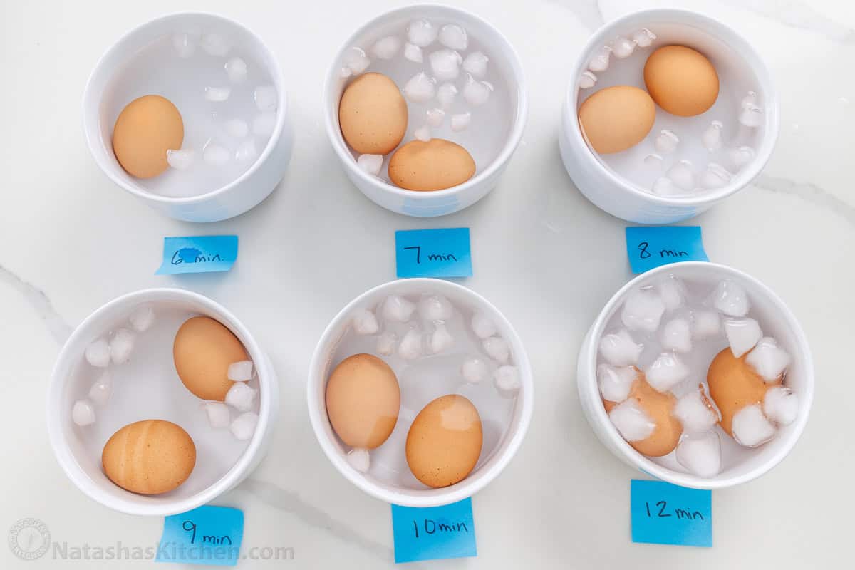 Learn how to boil eggs with exact cook times for soft, jammy, medium, or hard-boiled eggs, plus tips for easy-peel shells every time. Testing how to boil eggs with eggs in individual bowls and various timers