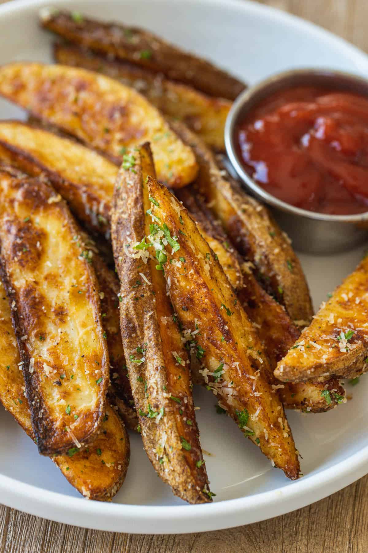 Plate of oven roasted potato wedges