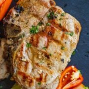 Grilled pork chops served on a platter