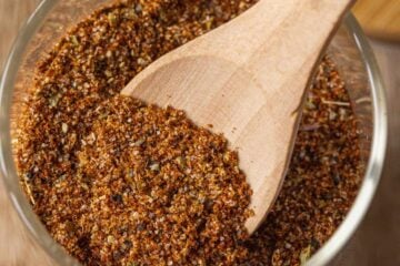Wooden spoon in jar of taco seasoning