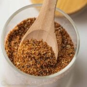 Wood spoon in jar of taco seasoning