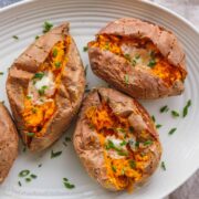 Baked sweet potatoes served on platter