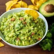 Guacamole served in a bowl with tortilla chips