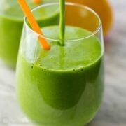 Green smoothie poured into glass cup
