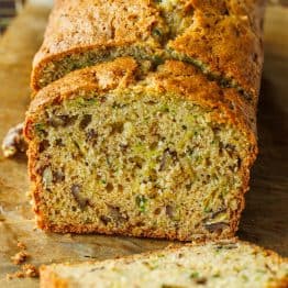 Homemade Zucchini Bread sliced on parchment paper