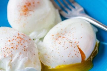 Poached Eggs served on a plate seasoned with paprika