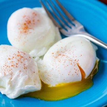 Poached Eggs served on a plate seasoned with paprika