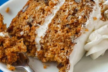 Carrot cake slice served on a plate with fork
