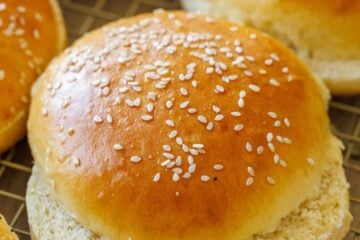 Cut homemade hamburger buns with sesame seeds