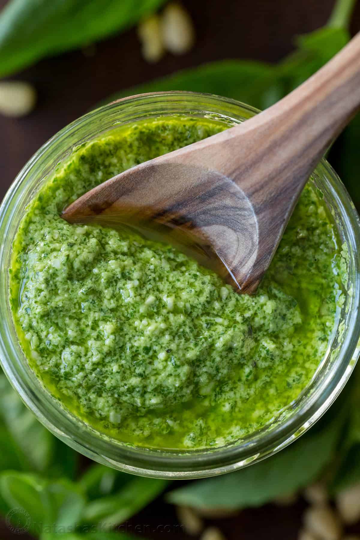 spoonful of fresh basil pesto sauce