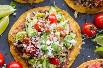 Tostadas assembled with lime wedges