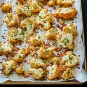 Pan roasted parmesan cauliflower with parmesan, mozzarella. and finely chopped parsley on top