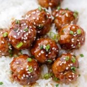 Teriyaki Meatballs served over rice with sesame seeds and chive garnish