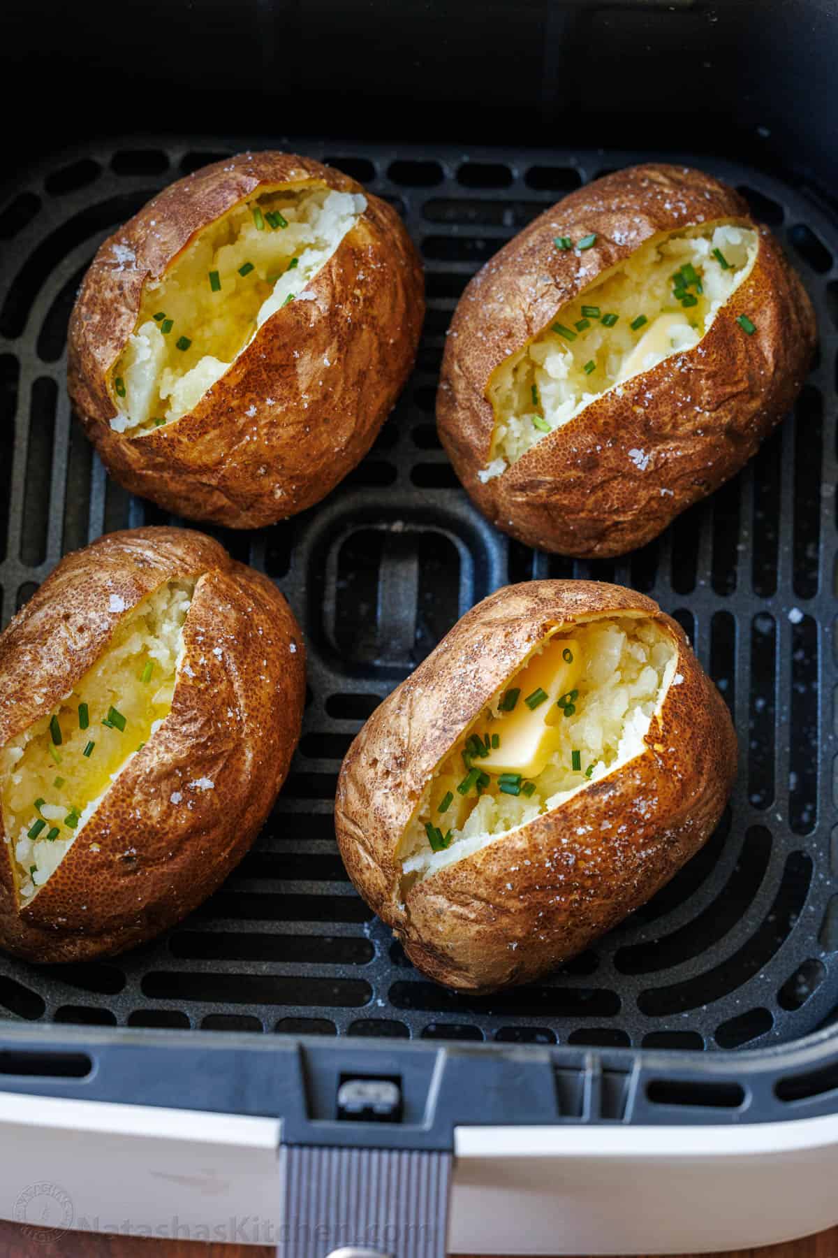 Air Fryer Baked Potatoes in the air fryer basket