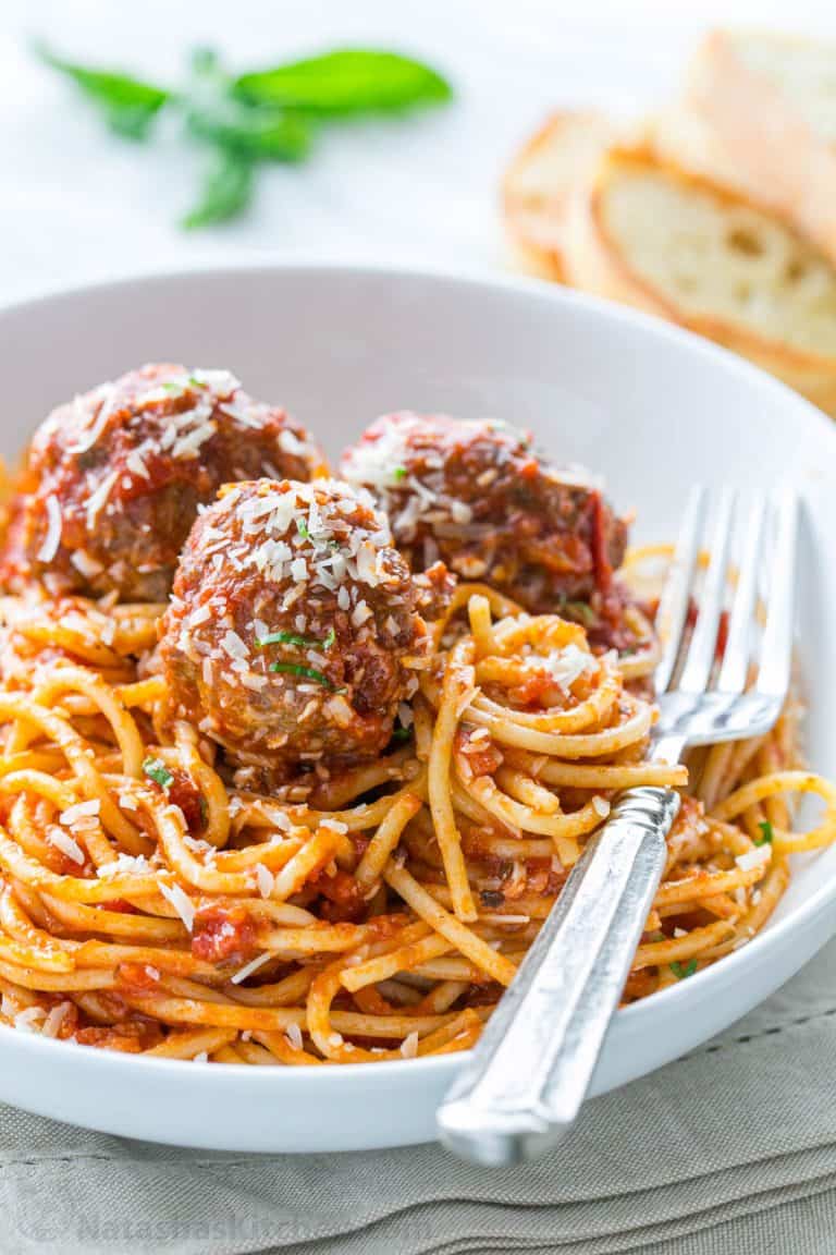 Spaghetti and meatballs served with a fork