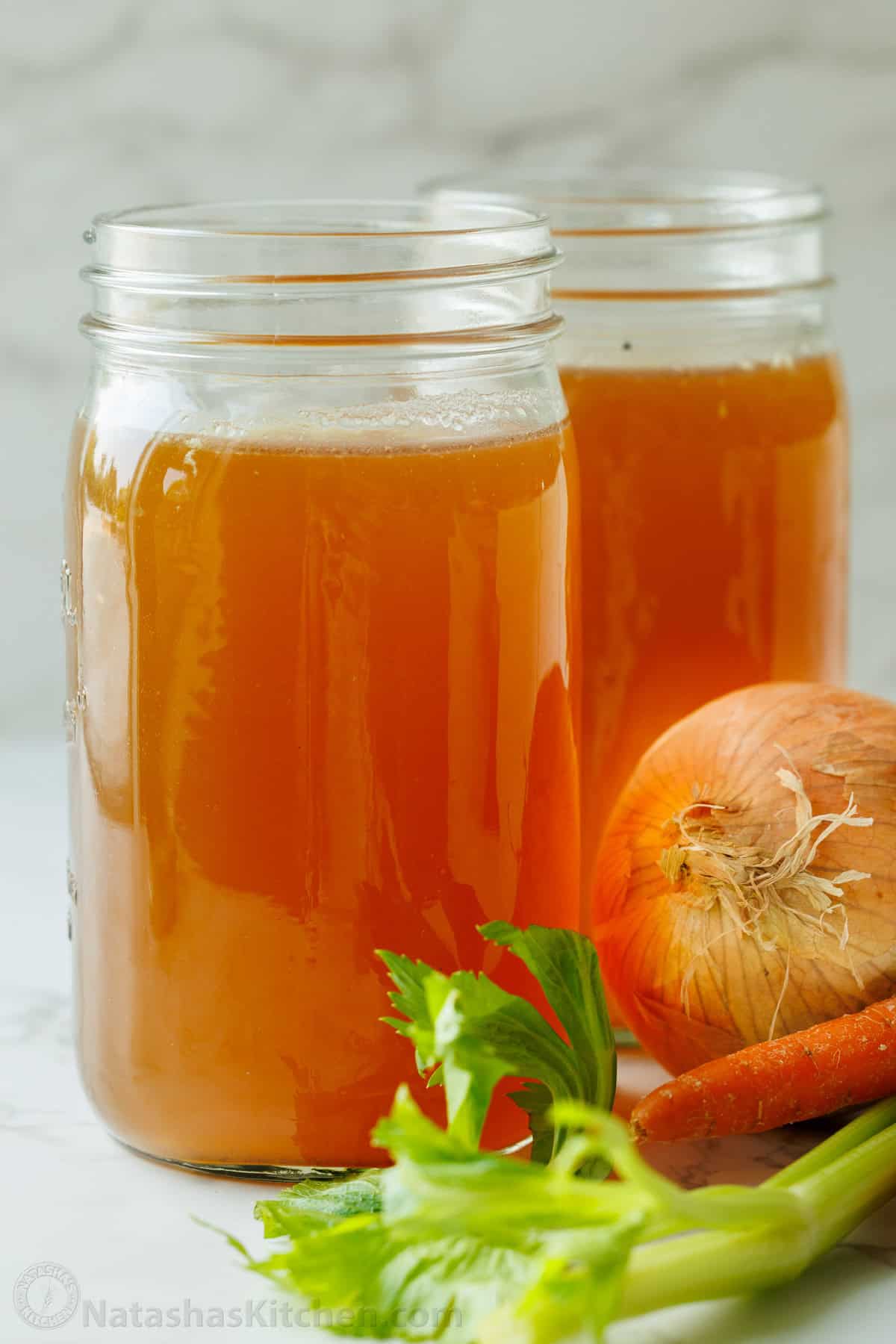 Make this easy beef stock in the slow cooker, stovetop, or Instant Pot. This beef bone broth is rich in flavor and better than store-bought. Mason jar of homemade bone broth with onion, carrot and celery