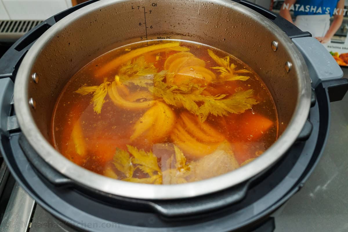 Make this easy beef stock in the slow cooker, stovetop, or Instant Pot. This beef bone broth is rich in flavor and better than store-bought. Cooked beef stock in a pot