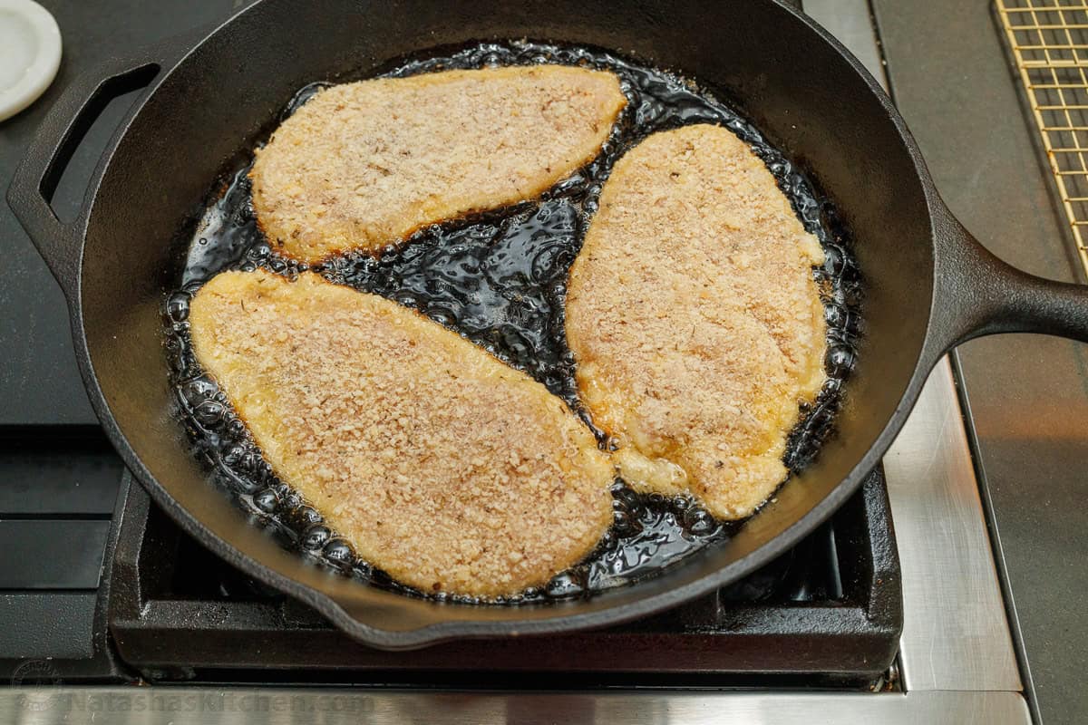 Easy breaded chicken cutlets recipe ready in under 30 minutes. Crispy on the outside with juicy chicken inside. Kid-friendly chicken dinner! how to pan-fry breaded chicken cutlets in a cast iron skillet