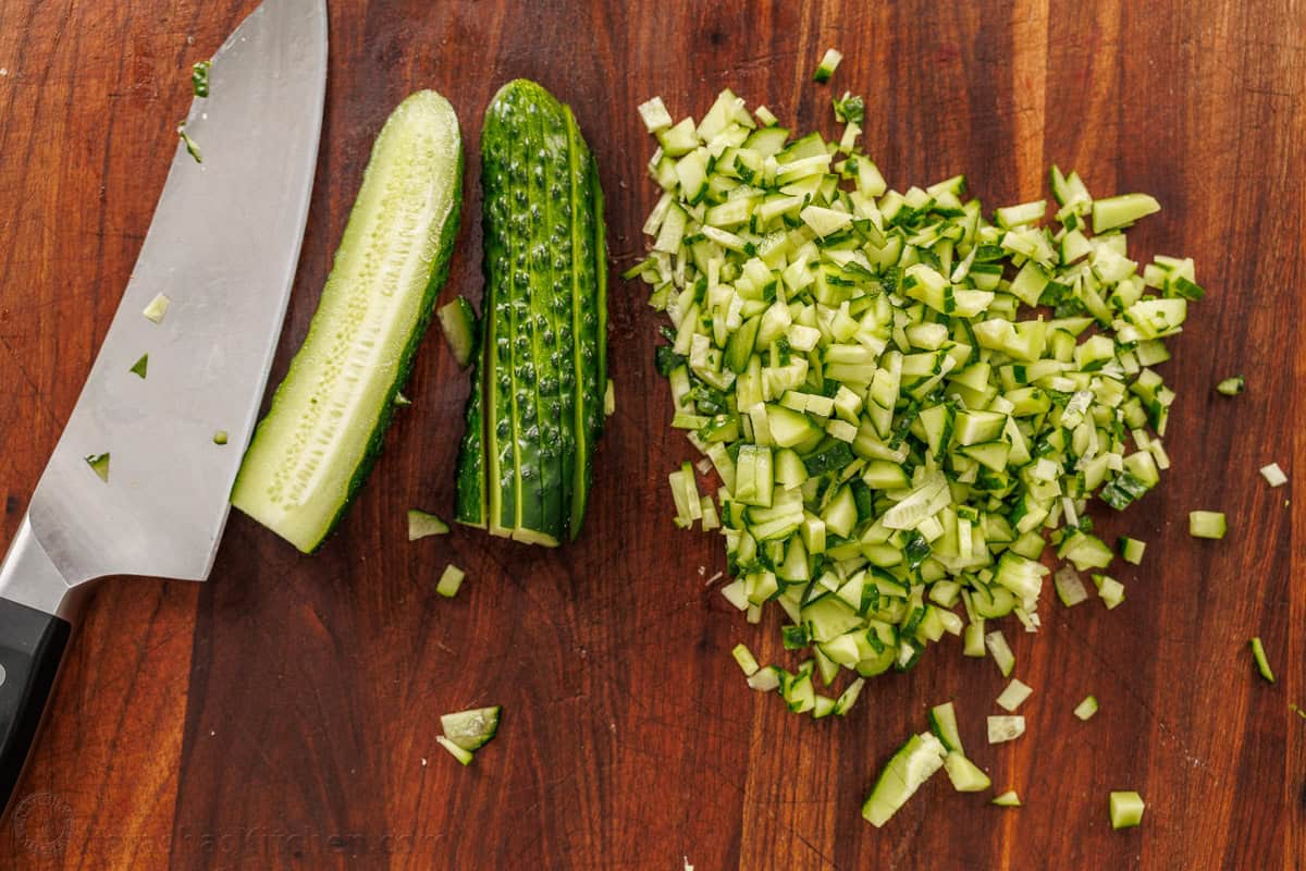 This easy Green Goddess Salad recipe comes together in minutes for the perfect side dish or lunch. Eat with a tortilla chip for a fun twist! How to cut cucumber into confetti pieces using a large knife