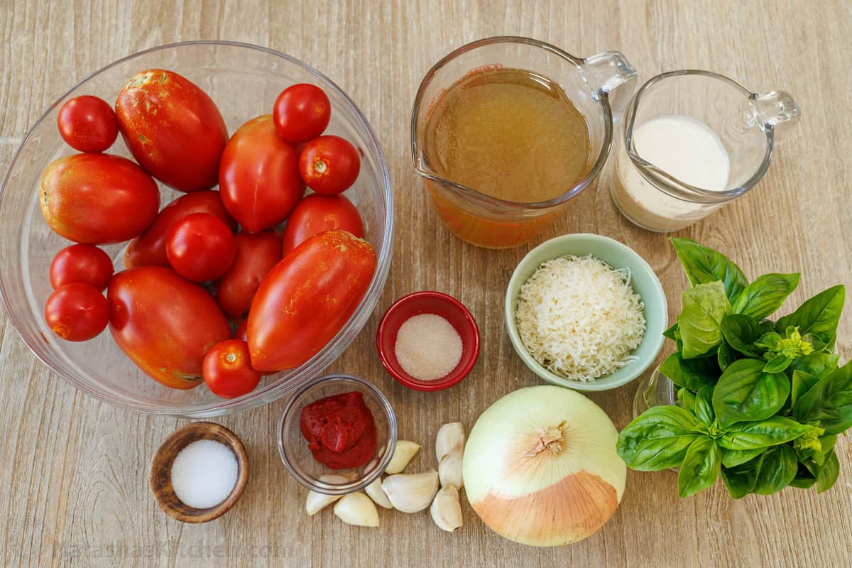 Roasted tomato soup has layers of delicious flavor for a creamy satisfying and easy dish. Pair with Grilled Cheese for the best Fall recipe. ingredients for the Italian stew with basil, onion, garlic, paste, salt, Parmesan, sugar, chicken stock and heavy cream