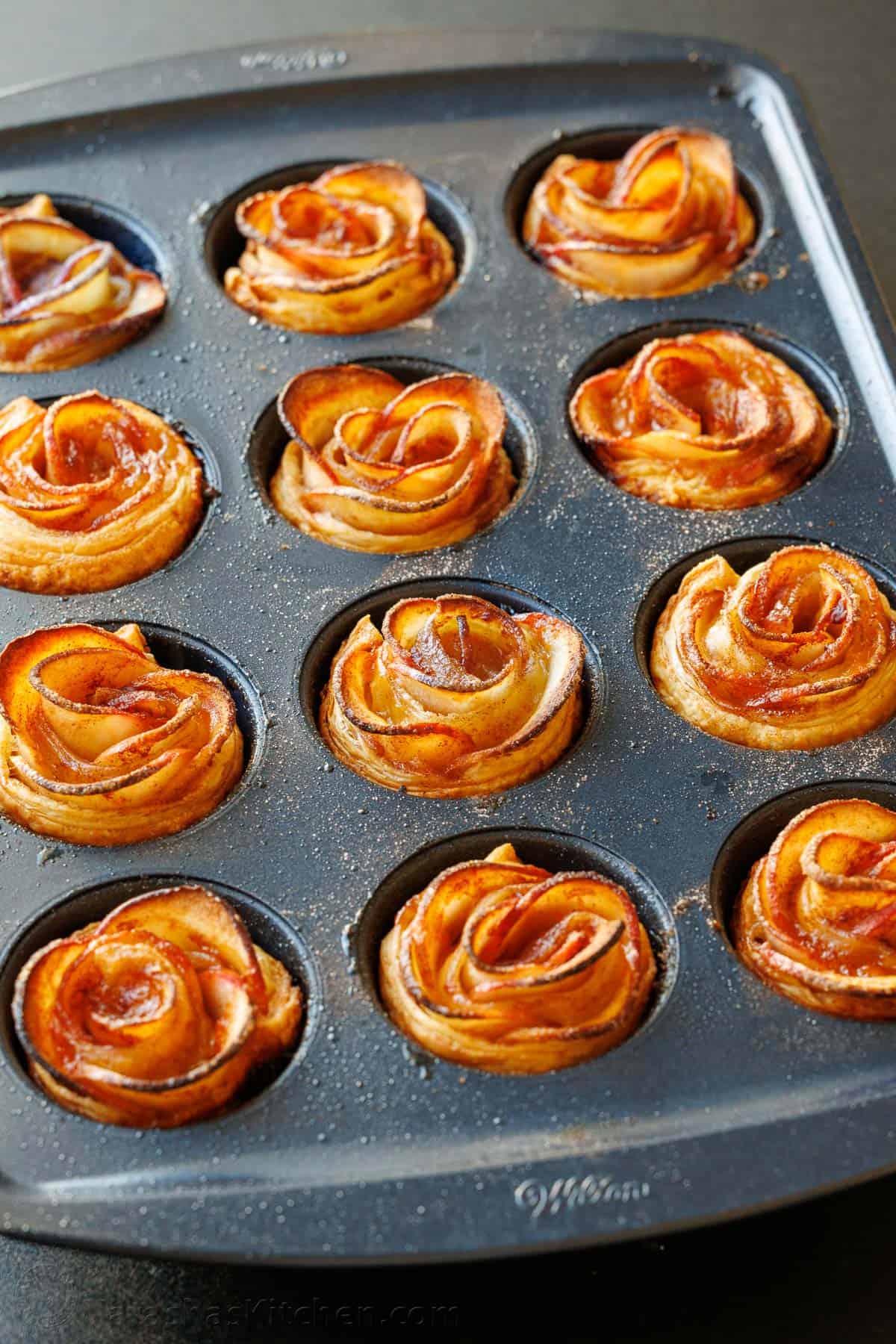 Apple roses recipe in a muffin tin with browned edges