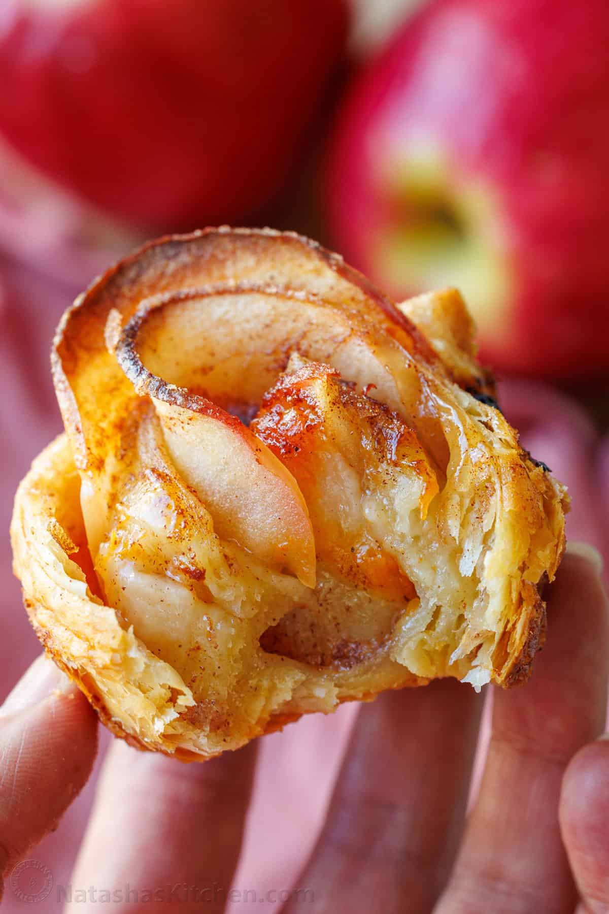 a bite taken out of an apple rose pastry