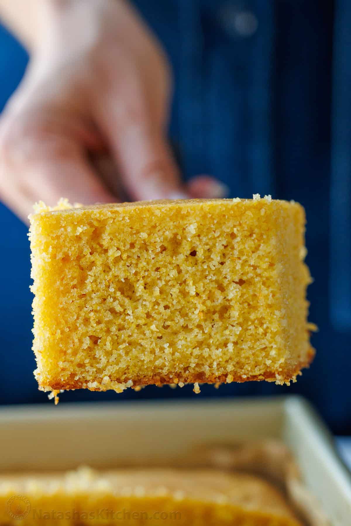 The best homemade cornbread recipe is easy to make with pantry staples. Serve with your favorite holiday or BBQ menu and honey butter on top. A slice of cornbread with moist crumb