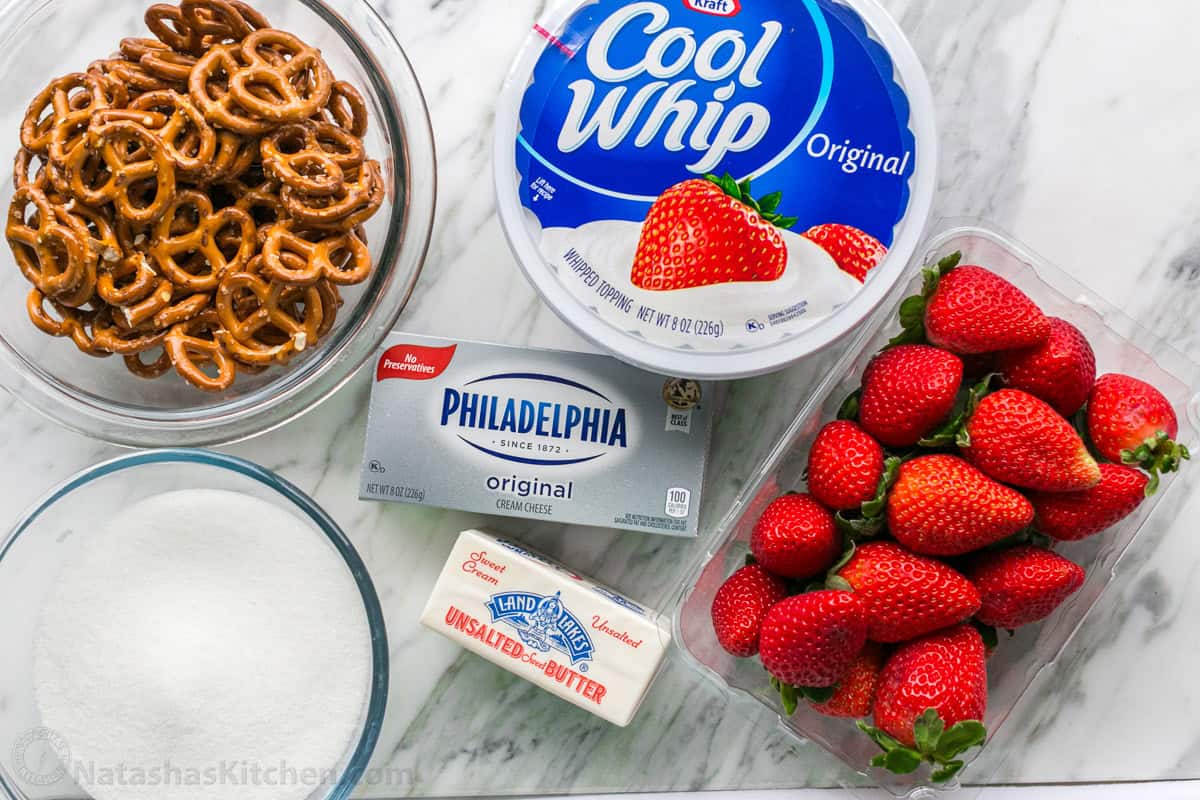 Easy Strawberry Pretzel Salad is a crowd-favorite dessert recipe at parties and picnics! Easy make-ahead directions everyone will love! Summer jello dessert ingredients using strawberries and coolwhip