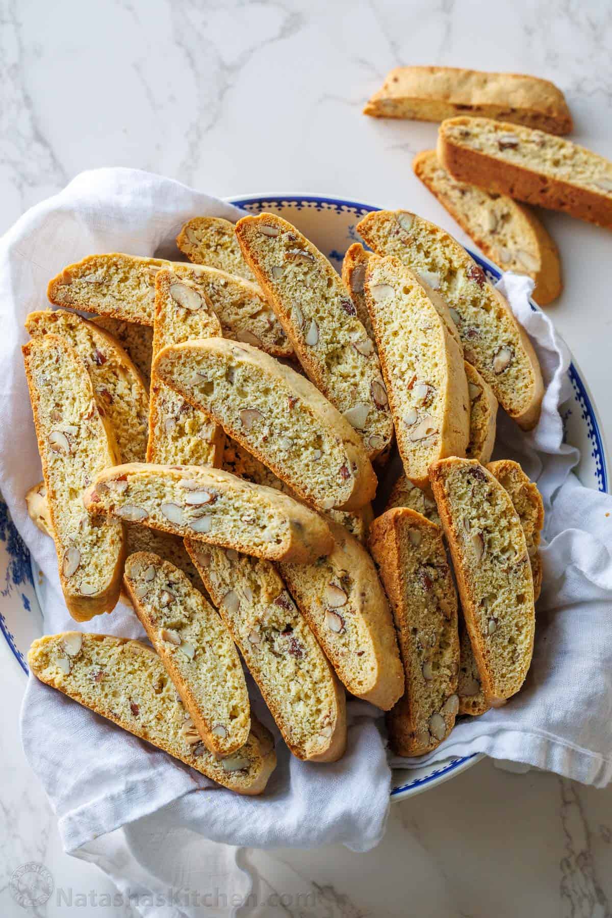 almond biscotti recipe in a white and blue bowl